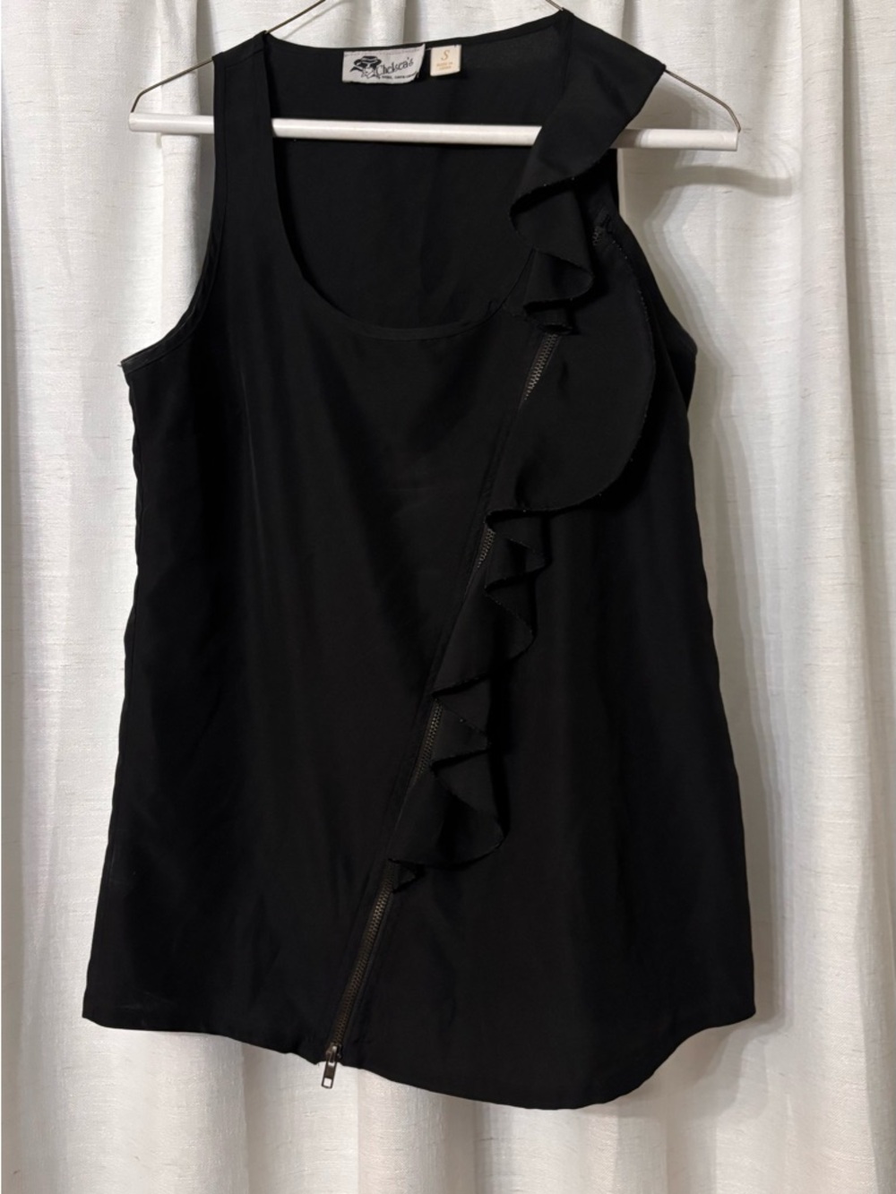 Black Ruffle Zip Front Sleeveless Top by Chelsea